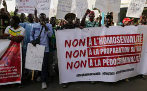FILE PHOTO: Anti-LGBT demonstrators march through the streets during a protest calling for tougher action in Dakar